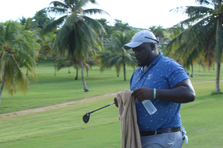 Jamaican Wesley Brown strides to the 16th tee