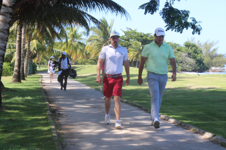 Josh Anderson (Left) and Xuechen Yu (Right) makes their way to the green on hole 4 at Tryall Golf Club