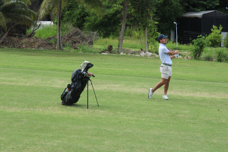 Justin Burrowes watches his ball land on the green at hole 15 at Tryall
