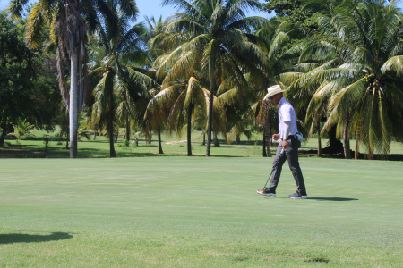 Logan Bryant celebrates after shoting a par on the 15th hole