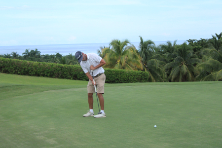 Ryan Sullivan sinks his putt on the 14th hole