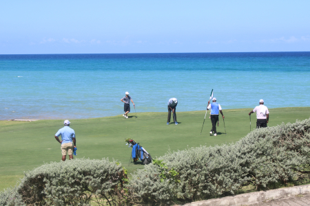 The group of Birsick Fanklin, Allan Hutton and Easton Williams battle strong winds on a trick par 3 on hole 4 at Tryall